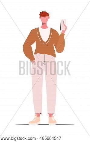 Young Guy In Modern Casual Clothes With A Phone In His Hand. Flat Vector Cartoon Illustration Isolat