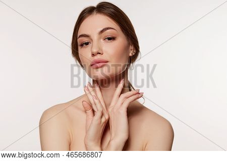 Portrait Of Young Beautiful Woman With Perfect Smooth Skin Isolated Over White Background. Facebuild