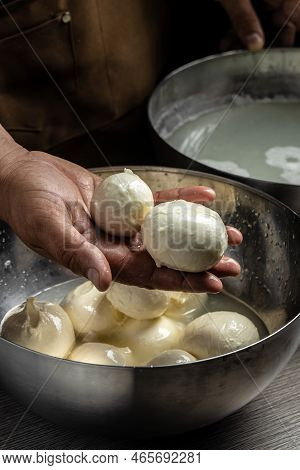Cheesemaker, Showing Freshly Made Mozzarella. The Homemade Cheese Maker Produces Caciocavallo. Pasta
