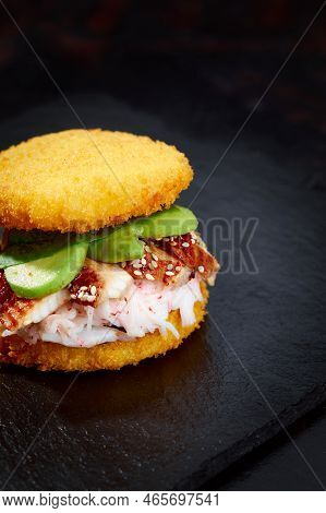 Pan-asian Cuisine Concept. Japanese Sushi Burger Made From Rice Bread, Crab Meat, Avokado And Wasabi