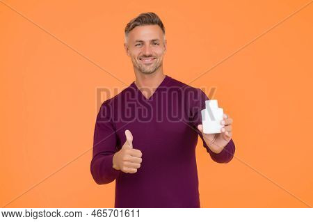 Body Care. Presenting Product. Mature Man Pointing At Bottle. Favorite Lotion After Shaving. Worth T