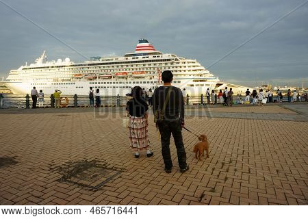 Yokohama Japan - Sept 14, 2019: People Sees Off A Cruise Ship. Cruise Ship Asuka Ii At Sunset