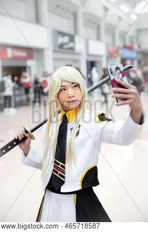 Birmingham Nec, Uk - November 13, 2022.  A Young Korean Cosplayer Girl Dressed As A Popular Korean O