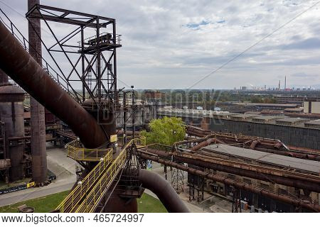 Ostrava, Czech Republic - September 23, 2020: Tall Chimney And Historical Buildings In Ostrava Dolni