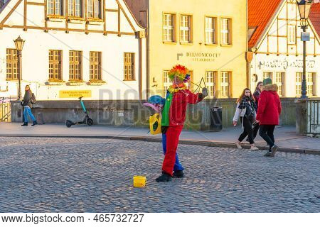 Gdansk, Poland - 11 March, 2022: A Man In Cloun Form Blows Soap Bubbles In Gdansk