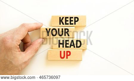 Keep Your Head Up Symbol. Concept Words Keep Your Head Up On Wooden Cubes. Beautiful White Table Whi