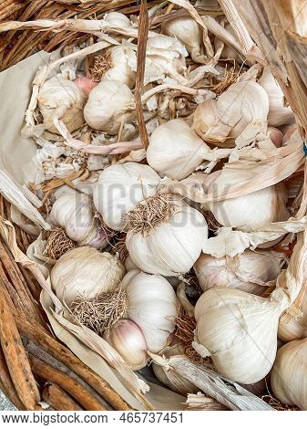 White Garlic Pile Texture. Fresh Garlic On Market Table Closeup Photo.