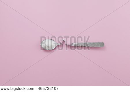 Collagen Powder Or Protein In Silver Spoon On Pink Background. Space For Text. Healthy Food Suppleme