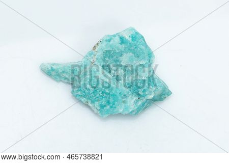 Natural Amazonite Gemstone Isolated On White Background. A Bluish-green Crystal On A White Backgroun