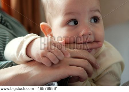 Cute Adorable Newborn Baby Playing With Colorful Rattle Toy. Baby With Teether. Six Months Old Lovel