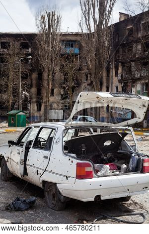 Irpin, Kyiv Region, Ukraine -  April 12, 2022: Russian Invasion Of Ukraine. Car Damaged By Russian S