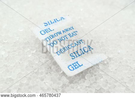 Packet Of Silica Gel Sands Buried In Silica Crystals. There Are Caution Words 