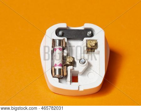 3-pin, 13 Amp Electrical Plug. Engineering Concept Orange Isolated