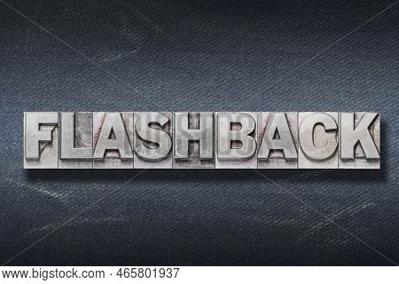 Flashback Word Made From Metallic Letterpress On Dark Jeans Background