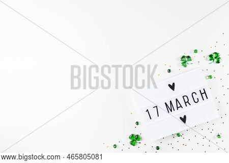 Lightbox With Saint Patricks Day Greeting And Shamrocks Of Green Glass Hearts