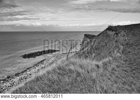 Hundested, Denmark On The Cliff Overlooking The Sea Taken In Black And White. Baltic Sea Coast, Gras