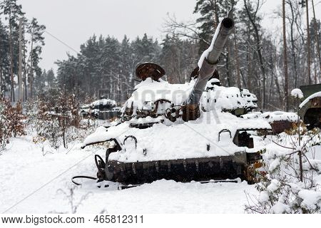 Russian Battle Tank In The Snow Which Was Destroyed On The Roadside Of Highway During Hostilities In