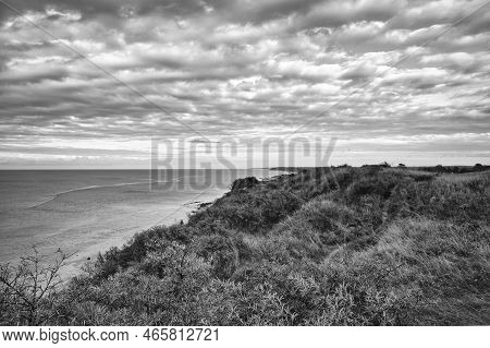 Hundested, Denmark On The Cliff Overlooking The Sea Taken In Black And White. Baltic Sea Coast, Gras