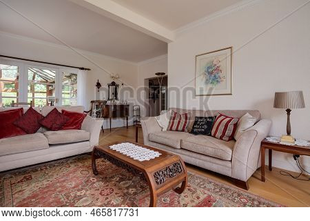 Foxton, Cambridgeshire - June 21 2018: Traditionally Furnished Open Plan Living Room With Exposed Ti