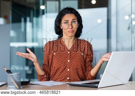 Frustrated And Tired Business Woman Looking At Camera, Hispanic Woman Unhappy With Work Result, Work