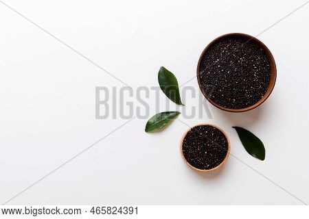 Quinoa Seeds In Bowl On Colored Background. Healthy Kinwa In Small Bowl. Healthy Superfood.