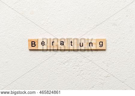 Beratung Word Written On Wood Block. Beratung Text On Cement Table For Your Desing, Concept.