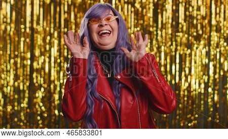 Joyful Woman With Purple Wig Laughing Out Loud After Hearing Ridiculous Anecdote, Funny Joke, Feelin