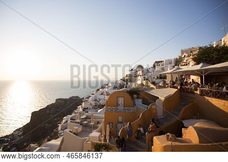 Santorini, Greece - September 2, 2021: View At Tousrists At Oia Village On Santorini Island In Greec
