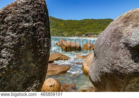 Rocks, Waves And Forest In The Beach