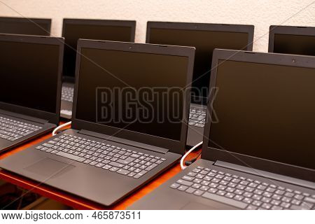 Many Laptops Are On The Table. Computer Exhibition Demonstration. It Technology. Internet Network Of