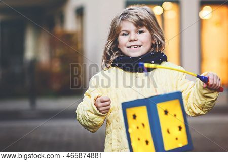 Little Preschool Kid Girl Holding Selfmade Traditional Lanterns With Candle For St. Martin Processio