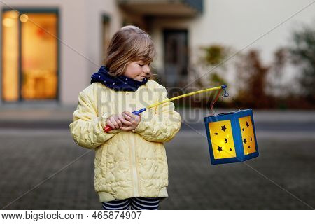 Little Preschool Kid Girl Holding Selfmade Traditional Lanterns With Candle For St. Martin Processio
