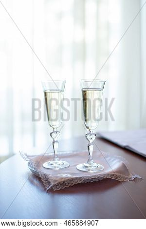 Wedding Gold Rings On The Table In The Registry Office. Wedding Celebration. Concept For Event Agenc