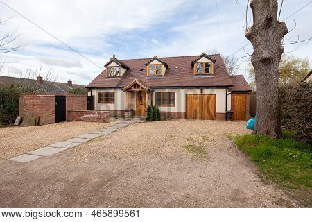 Toft, Cambridgeshire, England - March 4 2019: Traditional Style Modern Detached Home With Rendered E