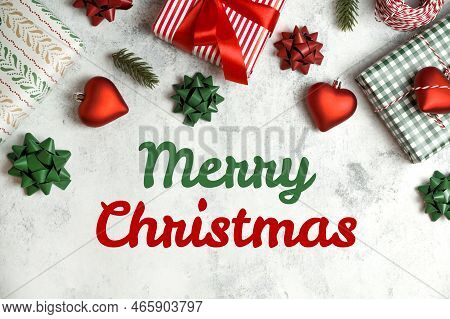 Merry Christmas Text Surrounded With Ornamnet,gifts,bows,etc In Red,white And Gree. Traditional Flat