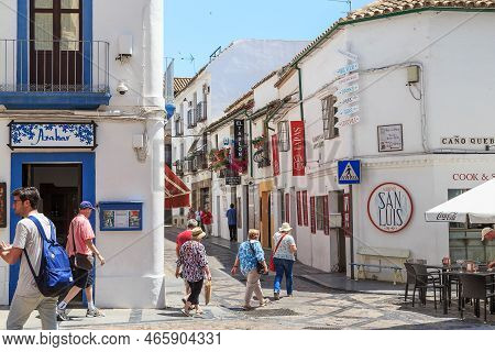 Cordoba, Spain - May 23, 2017: Unidentified Tourists Inspect The Houses And Streets Of The Medieval 