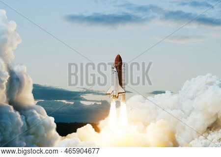 Spaceship Lift Off. Space Shuttle With Smoke And Blast Takes Off Into Space On A Background Of Blue 