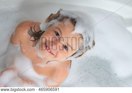 Kids Shampoo. Foam On Child Head. Kid Having Fun In The Bath With Bubbles. Happy Child Enjoying Bath