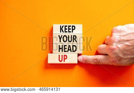 Keep Your Head Up Symbol. Concept Words Keep Your Head Up On Wooden Cubes. Beautiful Orange Table Or