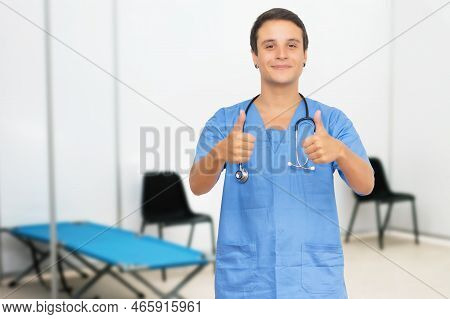 Optimistic American Male Nurse At Vaccination Station Is Ready For Vacinating Patients Against Coron