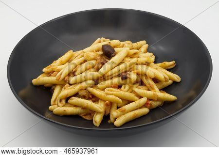 Italian Maccheroni Al Pettine Pasta In A Black Dish.