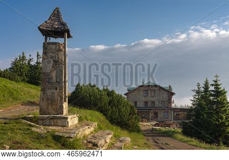 Stone Bell Tower And Old Stone Mountain  Cottage ( Serak) In Jeseniky Mountains On A Summer Foggy Mo