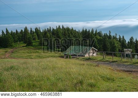 Wooden  Shed  In Jeseniky Mountains On A Summer Foggy Morning And  Sea Of Clouds Around Mountain Pea