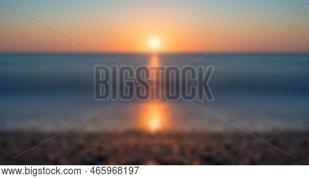 Abstract Defocused Blured Background Abstract View On The Beach With Sunset Reflect In Sea. Long Exp