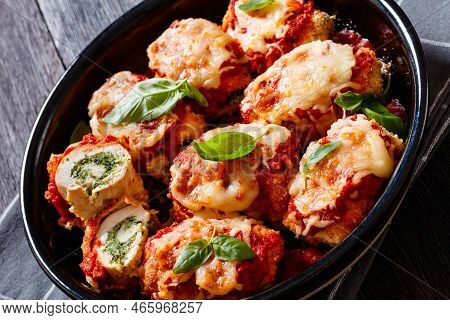 Chicken Rollatini With Spinach Ricotta Filling In Marinara Sauce Topped With Mozzarella Cheese And F