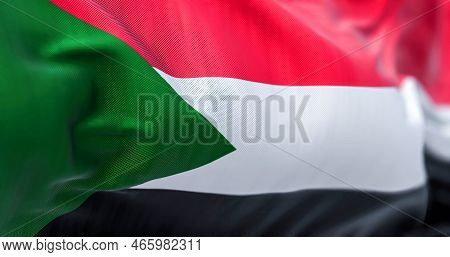 Close-up View Of The Sudan National Flag Waving In The Wind. The Republic Of Sudan Is A Country In N