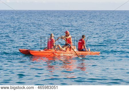 Savona, Italy - August, 16, 2019: Italian Lifeguards During Service On Red Italian Rescue Lifeboat S