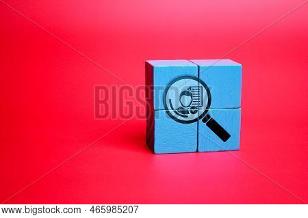 Colored Wooden Cube With Magnifying Glass Icon And Man Inside For Buyer Persona, Customer Target Con