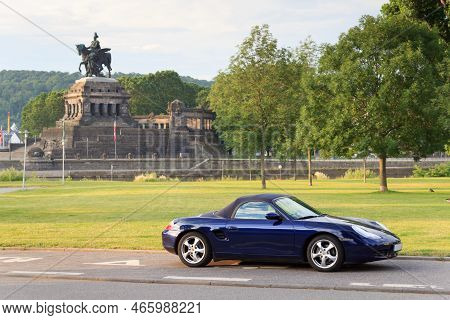 Koblenz, Germany - June 28, 2021: Blue Roadster Porsche Boxster 986 With Deutsches Eck (german Corne