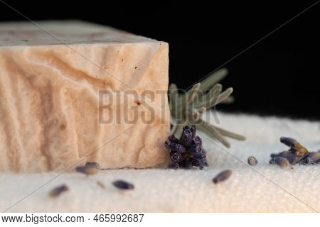 Closeup Of Handmade Soap With Rosemary On Bamboo Facecloth